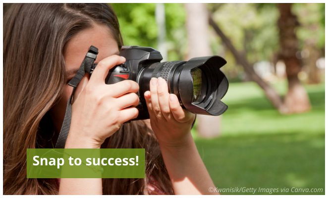 Young lady taking photos outdoors.