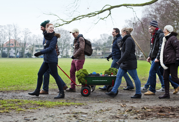 People walking with cart
