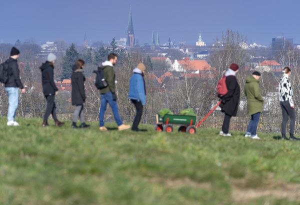 People walking with cart