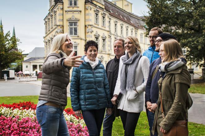 Group of people talking in town centre