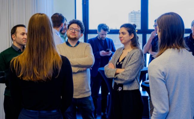 A group of people interacting at an event. 