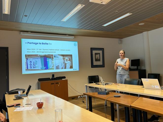 Photo of person presenting slides