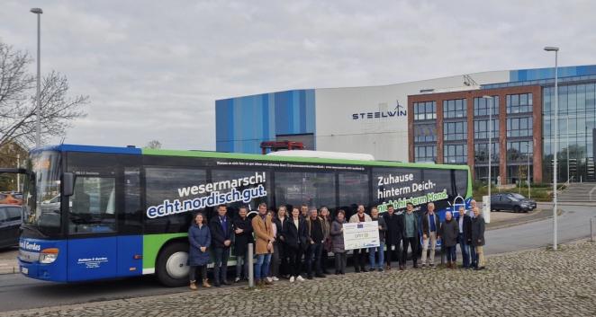 decorative - people standing in front of a bus for a group photo
