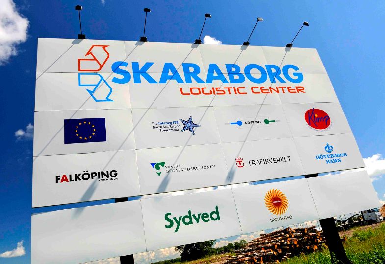 Big billboard signposting the Skaraborg Logistics Centre, including a large EU flag.