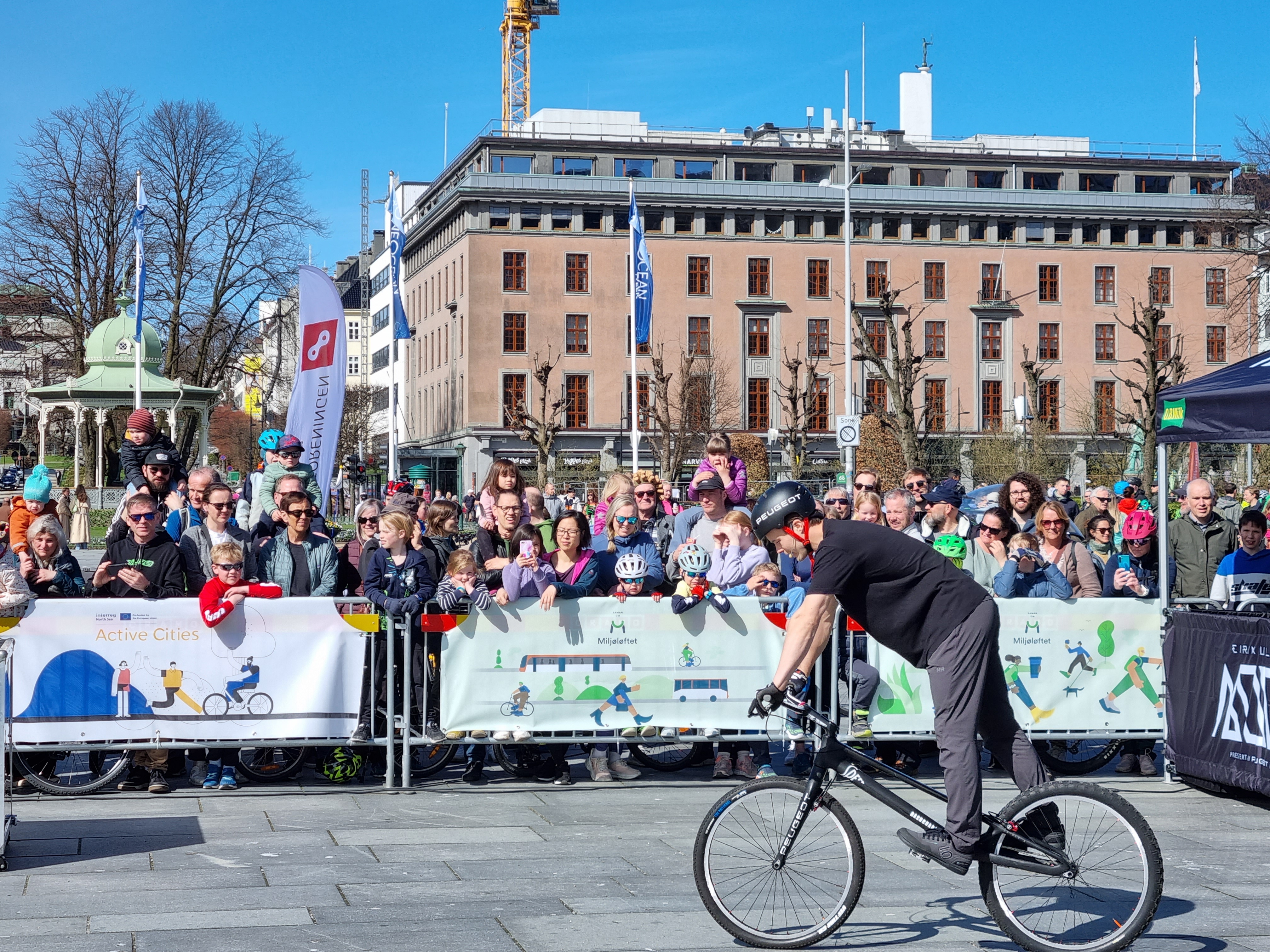 Residents watch the bicycle parade at the opening ceremony