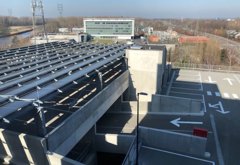 A  large building complex fitted with solar panels