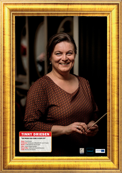 Portrait photo of a lady in a golden frame.