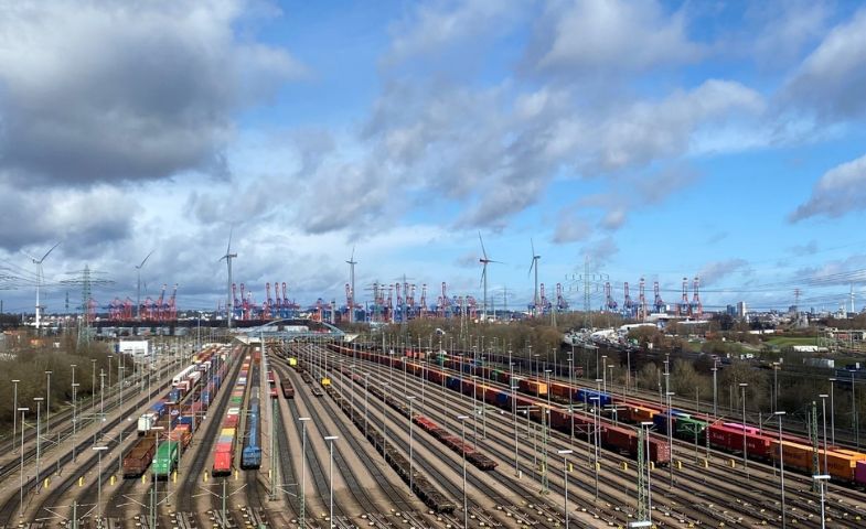 A cargo train railway station with many rail lines. 