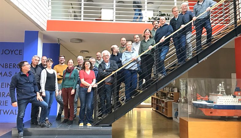 A group of people on a staircase.