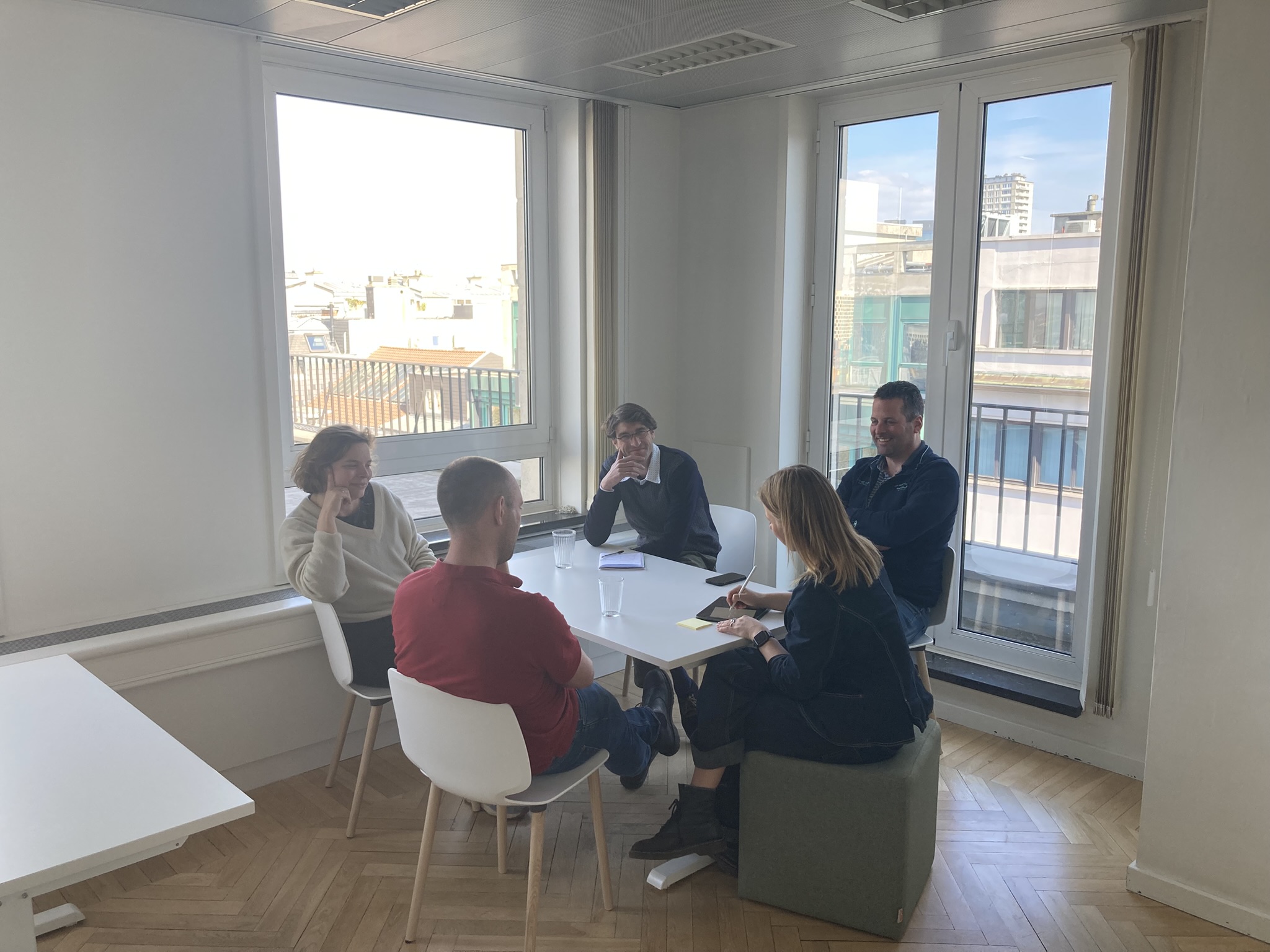 sitting at a table in a group