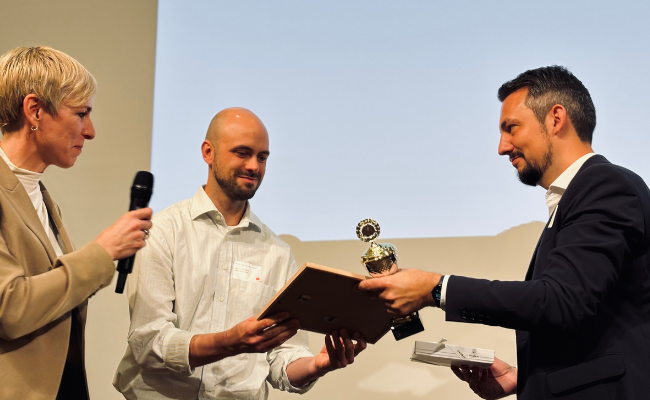 A person receiving an award on stage.