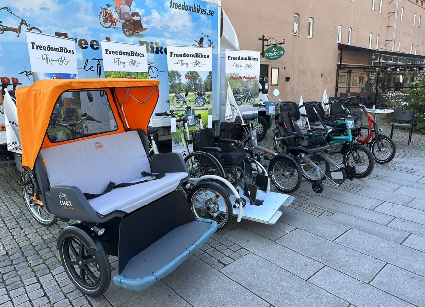 The image shows a series of adapted vehicles like tricycles and rickshaws