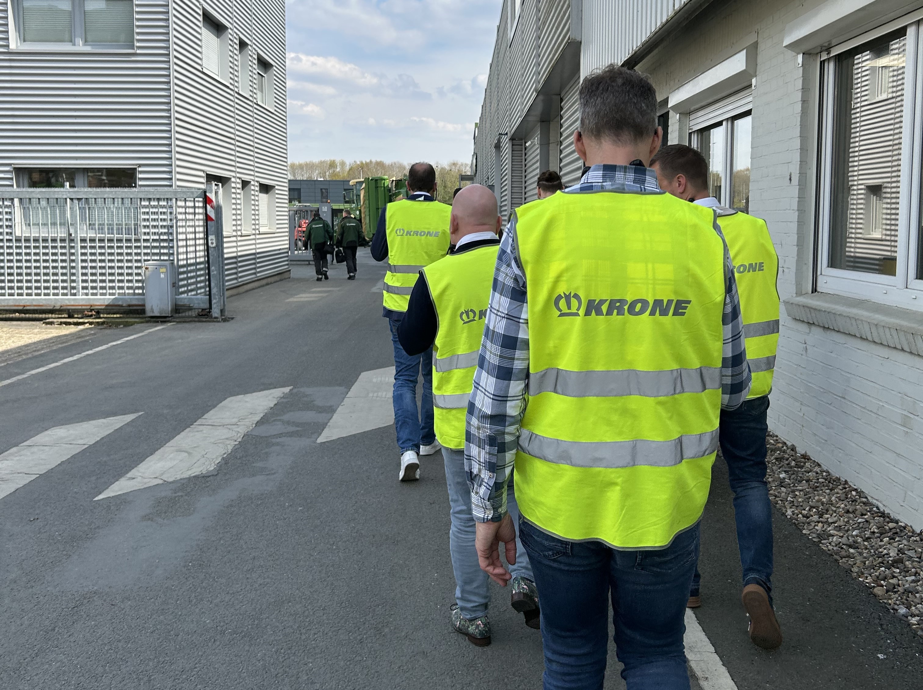 People in bight yellow vests during the krone factory tour