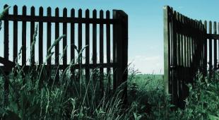 Fence with an open gate.