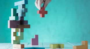 Coloured building blocks forming a structure.