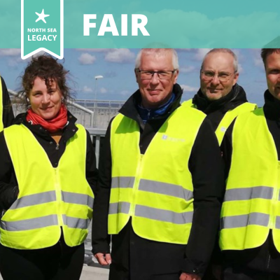 People wearing yellow safety vests.