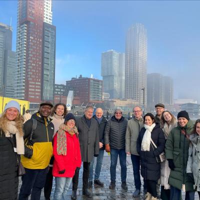 group of people in front of tall buildings in Rotterdam