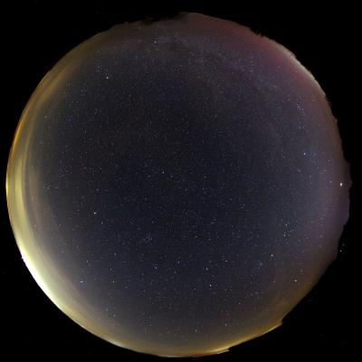 an all-sky picture with faint red polar light/aurora on the northwestern horizon (top right) (photo: A. Hänel)