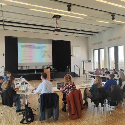 Photo of partners watching and listening to presentation