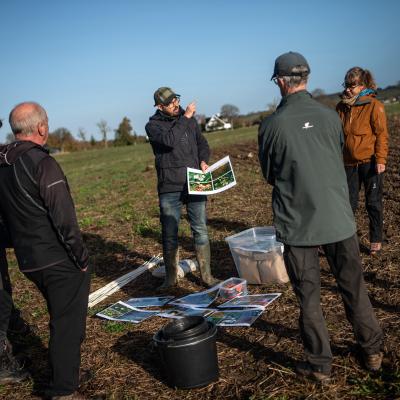 Photo of stood on field, planning wildflower planting