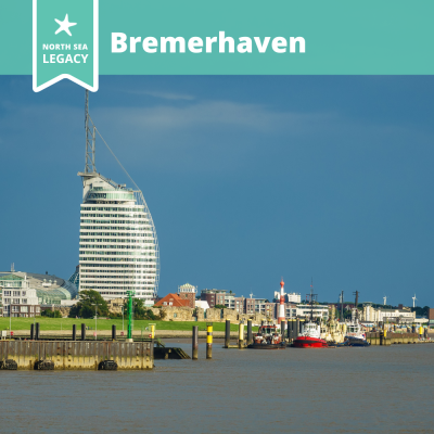 Panoramic view of Bremerhaven waterfront, dominated by a large white building.