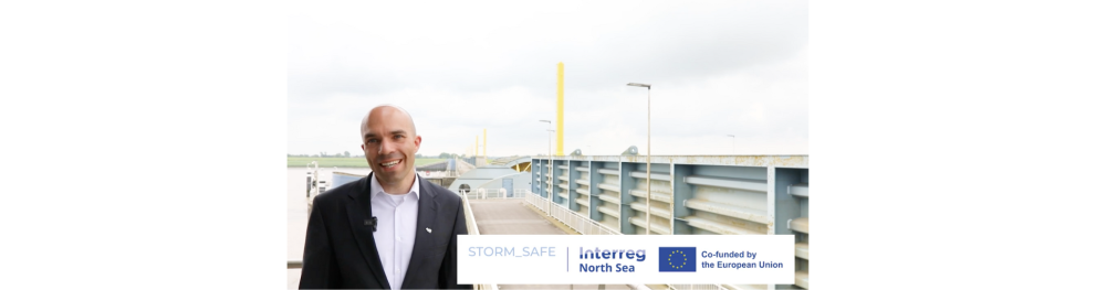 Photo of civil engineer Drosten standing in front of the Emsperrwerk