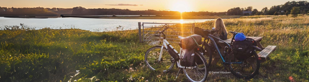 A cyclist enjoying the sunset over the North Sea region