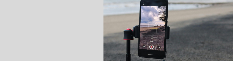 A mobile phone recording a beach scene