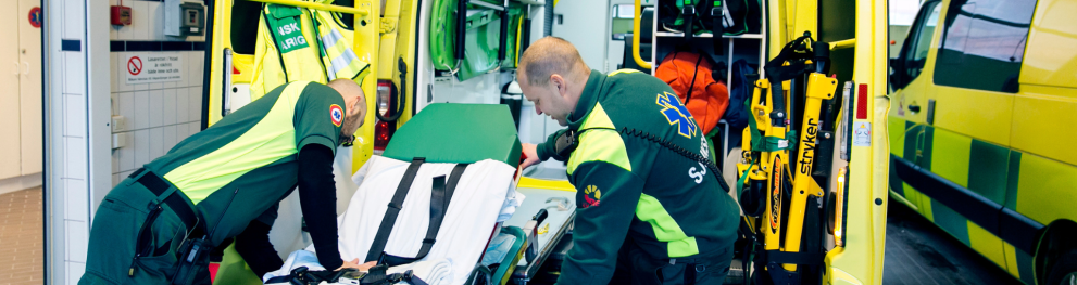 Paramedics in front of an ambulance
