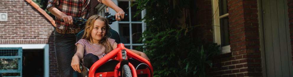Mother and child on a shared cargo bike
