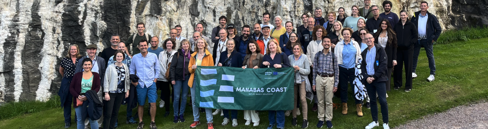 Group photo of the MANABAS team with the MANABAS flag