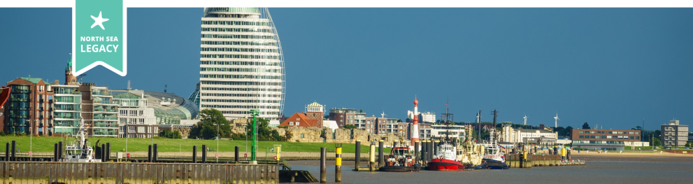 Panoramic view of Bremerhaven, dominated by a large white building.