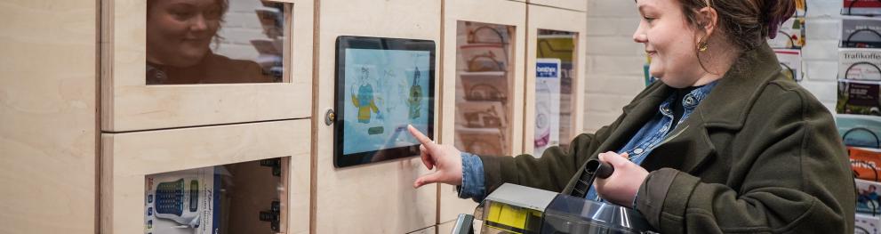 Photo of woman using sharing station 