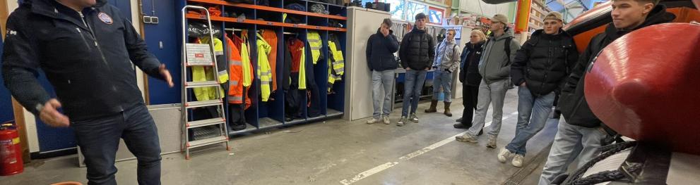 people standing in a shed